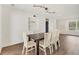 Dining room featuring stylish lighting, built-in shelves, and wood floors at 730 Buckskin Ct, Englewood, FL 34223