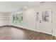 Bright living room featuring wood-look floors, built-in shelving, recessed lighting and natural light at 730 Buckskin Ct, Englewood, FL 34223