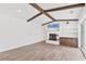 A spacious living room boasts tile floors, a brick fireplace and built in shelving at 730 Buckskin Ct, Englewood, FL 34223