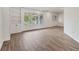 Bright living room features wood-look floors, built-in shelving, recessed lighting and natural light at 730 Buckskin Ct, Englewood, FL 34223