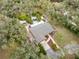 Overhead view of the property, highlighting a private pool area, verdant greenery, and home exterior at 746 Brentwood Dr, Venice, FL 34292