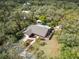 Aerial view of a home with a sprawling lawn, mature landscaping, fenced yard and a private swimming pool at 746 Brentwood Dr, Venice, FL 34292