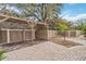Backyard with a wooden pergola, pavers, and a brown fence at 746 Brentwood Dr, Venice, FL 34292