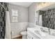 Updated bathroom featuring white subway tile, black accent tile and modern vanity at 746 Brentwood Dr, Venice, FL 34292