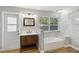 Bathroom featuring a window, a modern vanity, and a bathtub at 746 Brentwood Dr, Venice, FL 34292