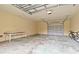 Spacious garage with ample room for storage and parking, featuring a modern overhead door at 746 Brentwood Dr, Venice, FL 34292