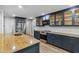 Well-lit kitchen boasts stainless steel appliances, ample storage, and stylish cabinetry at 746 Brentwood Dr, Venice, FL 34292