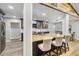 Modern kitchen features stainless steel appliances, wooden countertops, and a breakfast bar with seating at 746 Brentwood Dr, Venice, FL 34292