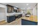 Spacious kitchen with modern cabinets, stainless appliances, wood countertops, and breakfast bar at 746 Brentwood Dr, Venice, FL 34292