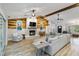 Bright living room with fireplace, wood ceiling beams and plenty of seating at 746 Brentwood Dr, Venice, FL 34292