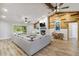 Open-concept living room with brick fireplace and sliding doors to the backyard at 746 Brentwood Dr, Venice, FL 34292