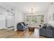 Bright living room features large windows and updated flooring at 746 Brentwood Dr, Venice, FL 34292