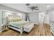 Spacious main bedroom with light wood flooring and an ensuite bathroom at 746 Brentwood Dr, Venice, FL 34292