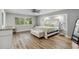 Spacious main bedroom with light wood flooring and a sitting area at 746 Brentwood Dr, Venice, FL 34292