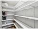 Well-organized pantry with ample shelving, perfect for storage and convenience at 746 Brentwood Dr, Venice, FL 34292