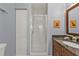 Well-lit bathroom with a glass shower enclosure and neutral wall paint at 8409 Placida Rd # 305, Placida, FL 33946