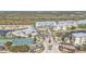 Overhead shot of the community featuring a pool, tennis courts, and well-maintained landscaping at 8409 Placida Rd # 305, Placida, FL 33946