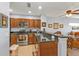 Kitchen features wood cabinetry, granite countertops and breakfast bar at 8409 Placida Rd # 305, Placida, FL 33946