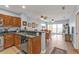 Living room with wood floors flowing into an open concept kitchen and access to private balcony at 8409 Placida Rd # 305, Placida, FL 33946
