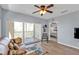Comfortable living room featuring a ceiling fan and an open doorway to the main bedroom at 8409 Placida Rd # 305, Placida, FL 33946