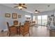 Cozy living room offers access to a private balcony with nature views at 8409 Placida Rd # 305, Placida, FL 33946