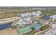 An aerial shot showcases the tennis, basketball court, and swimming pool recreational areas at 8409 Placida Rd # 305, Placida, FL 33946