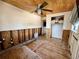 Bedroom with wood ceiling, closet, and walls and floor needing renovation at 8896 Gulf St, Placida, FL 33946
