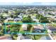Wide aerial view showcasing the property with a blue outline of the land, pool and surrounding homes at 9260 Saint Catherine Ave, Englewood, FL 34224