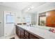 Bright bathroom with dual sinks, spacious countertop, and decor accents at 9260 Saint Catherine Ave, Englewood, FL 34224