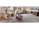 Bright living room with plush seating, decorative accents, and a large window for ample natural light at 9260 Saint Catherine Ave, Englewood, FL 34224