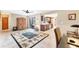 Spacious living area with tile flooring, ceiling fan, and sliding glass doors to the lanai at 9260 Saint Catherine Ave, Englewood, FL 34224