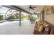 Enclosed patio with outdoor seating and a view of the pool at 9260 Saint Catherine Ave, Englewood, FL 34224