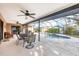 Relaxing outdoor patio featuring a private screened-in pool at 9260 Saint Catherine Ave, Englewood, FL 34224