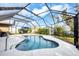 Inviting screened-in pool and outdoor patio area at 9260 Saint Catherine Ave, Englewood, FL 34224