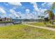 Spacious backyard, lovely canal view, and a private boat dock. Perfect for outdoor enjoyment at 9382 Rosebud Cir, Port Charlotte, FL 33981