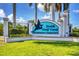 Entrance sign to South Gulf Cove Waterfront Community with lush landscaping at 9382 Rosebud Cir, Port Charlotte, FL 33981
