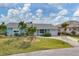 Charming single-story home with a well-maintained lawn and inviting curb appeal at 9382 Rosebud Cir, Port Charlotte, FL 33981