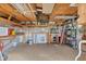 Spacious garage with unfinished ceiling, work bench, shelving, and plenty of room for storage at 9382 Rosebud Cir, Port Charlotte, FL 33981
