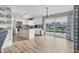 Bright kitchen featuring an island, white cabinets and pool views at 9382 Rosebud Cir, Port Charlotte, FL 33981