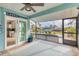Relaxing screened lanai with lovely views of the canal and pool, with sliding glass doors to the interior at 9382 Rosebud Cir, Port Charlotte, FL 33981