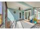 Inviting screened lanai featuring a ceiling fan, and views of the backyard at 9382 Rosebud Cir, Port Charlotte, FL 33981