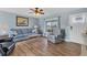 Cozy living space with lots of natural light, hardwood floors, and comfortable furnishings at 9382 Rosebud Cir, Port Charlotte, FL 33981