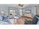 Relaxing living room filled with light, coastal décor, and hardwood flooring at 9382 Rosebud Cir, Port Charlotte, FL 33981