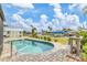 Inviting pool with beautiful landscaping, a shed for extra storage, and canal views at 9382 Rosebud Cir, Port Charlotte, FL 33981