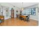 Formal dining room featuring hardwood floors, a chandelier, and natural light at 10 Seaward Cir, Placida, FL 33946