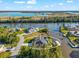 Aerial view of stunning home situated on a waterfront canal with a private boat dock and neighborhood at 10491 Sarasota Rd, Port Charlotte, FL 33981