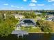 Home features a screened pool, boat dock, and solar panels in a waterfront setting at 10491 Sarasota Rd, Port Charlotte, FL 33981
