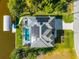 Aerial view of home with pool, solar panels, and a boat dock along a waterway in a tropical setting at 10491 Sarasota Rd, Port Charlotte, FL 33981