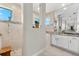 Modern bathroom featuring a walk-in shower, granite countertop, and decorative accents at 10491 Sarasota Rd, Port Charlotte, FL 33981