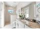 Elegant bathroom with a granite countertop, dual vanity, and a glass-enclosed shower at 10491 Sarasota Rd, Port Charlotte, FL 33981
